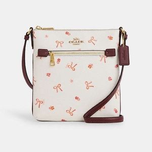 Coach brand new mini Rowan file bag purse with bow print